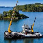 Workboat at sea with two Heila marine cranes on deck – Heila Cranes, Engineered for the Sea